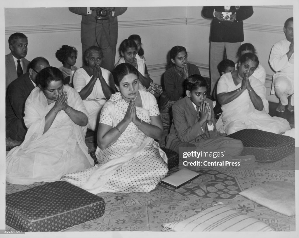 Sirimavo Bandaranaike, Prime Minister of Ceylon, taking part in a Buddhist blessing ceremony in Knightsbridge, London, Match 6th 1961. (Photo by Central Press/Hulton Archive/Getty Images)