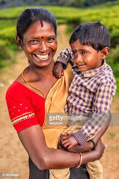 Portrait of Sri Lankan mother with her baby, Sri Lanka. Both parents of this little boy work on tea plantaion, near Nuwara Eliya. Sri Lanka (Ceylon) is the world's fourth largest producer of tea and the industry is one of the country's main sources of foreign exchange and a significant source of income for laborers.  http://bem.2be.pl/IS/sri_lanka_380.jpg